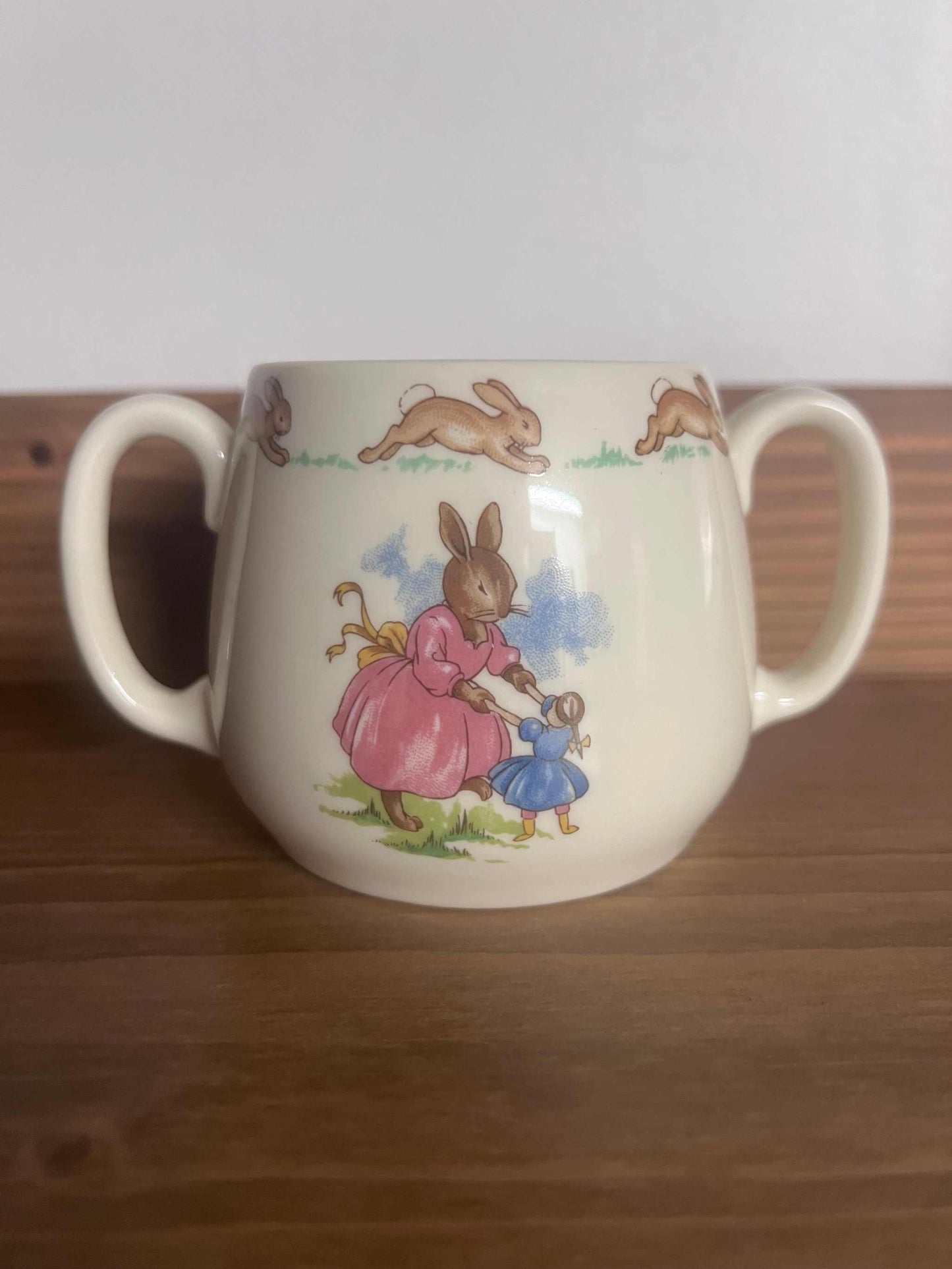 Royal Doulton Bunnykins mug, Vintage Bunnykins Hug a Mug, Bunnykins Twin Handled Cup. Made In England. Excellent vintage condition
