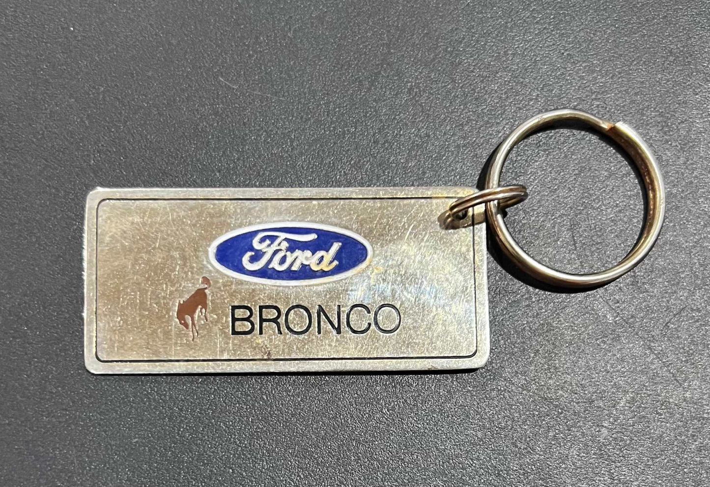 Ford Bronco Gold Plated Metal Keychain with Engravable Backside NOS Relic has been store safely away for decades and shows some wear but vintage from the 1980s