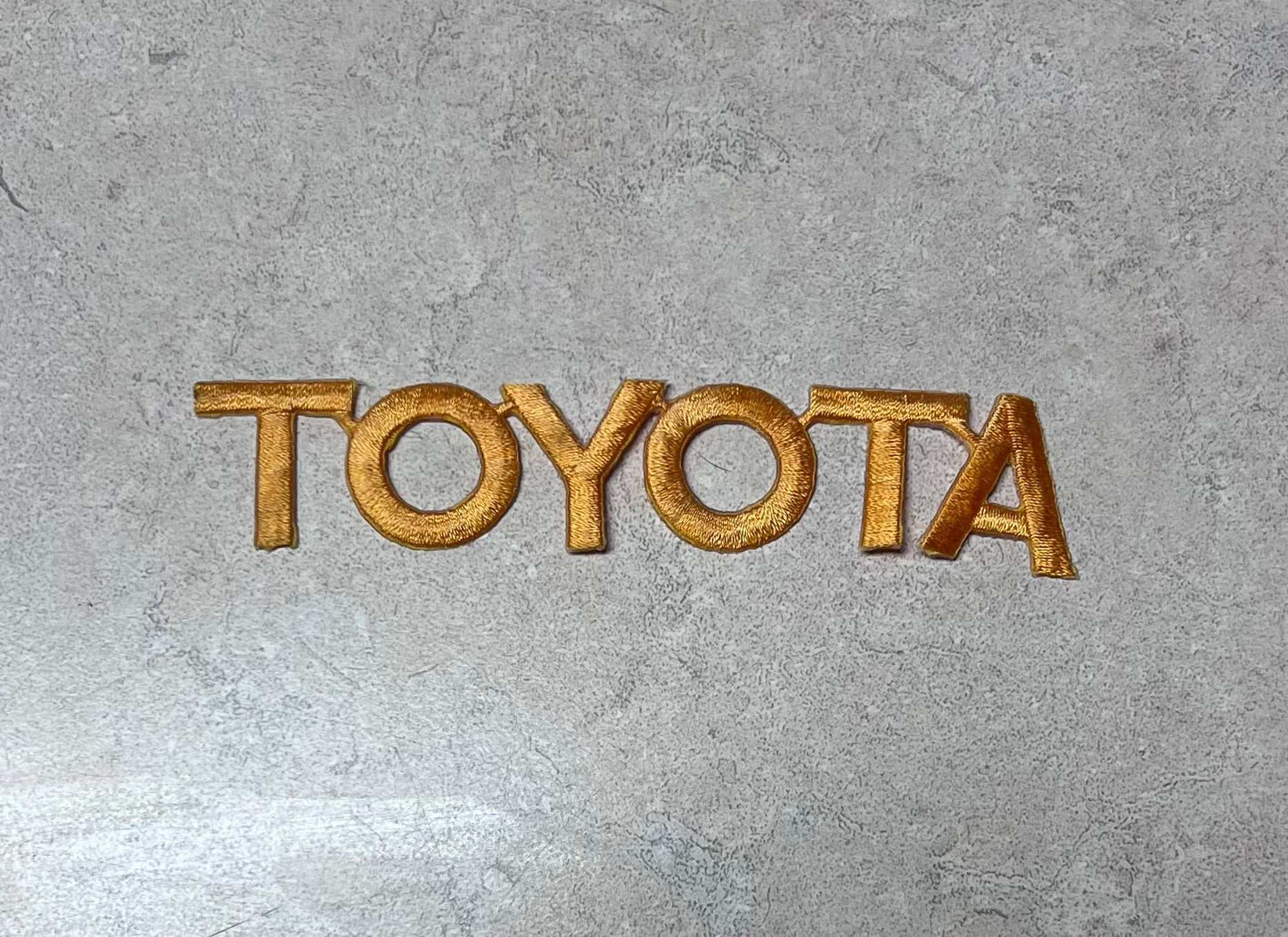 Toyota Gold Lettering Serviceperson Patch Auto NOS Excellent Condition Relic has been safely stored away for decades and measures approximately 1 x 5 inches