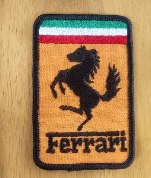 Vintage Ferrari Patch Orange Rectangle Vintage Auto NOS. This relic has been stored for decades and measures 4 inch in width by 2.5 inches in length. Great Rare Find
