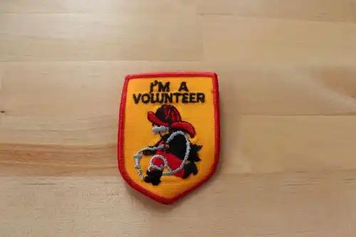 I'M A VOLUNTEER Fireman BADGE PATCH Character Unique Mint This is a 2 1/2 x 3 inch I'm A Volunteer patch with the Fireman logo. Vintage mint condition, never sewn or displayed. patch PG Relics