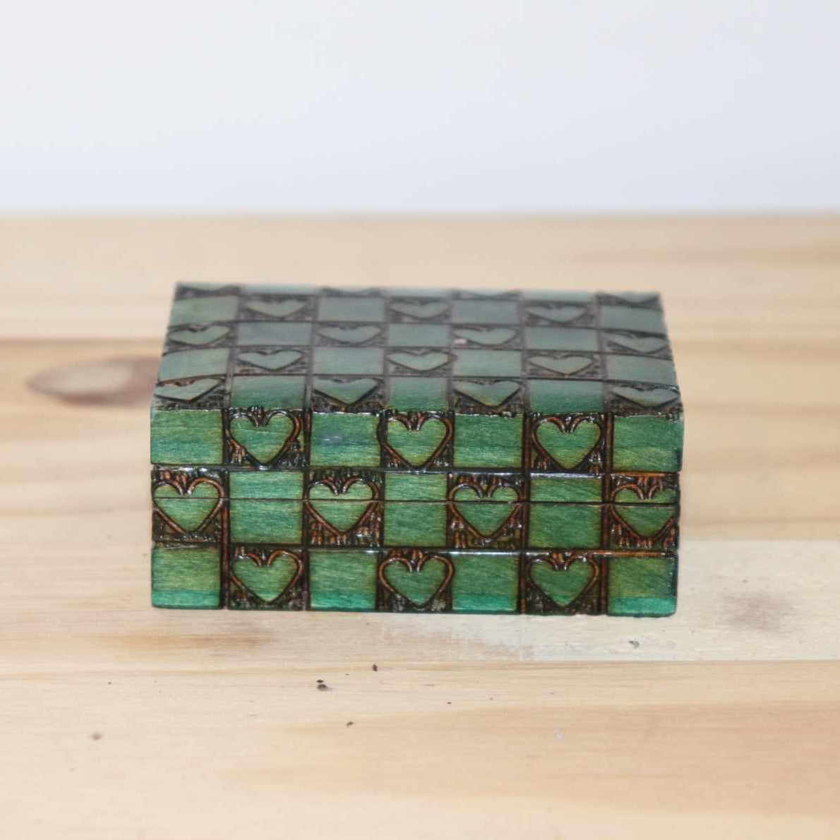 Wooden Chest Hearts Horse, natural wood, carved hearts, green color squares, detailed design and unique craftsmanship. Item measures approximately 3 x 2 inches