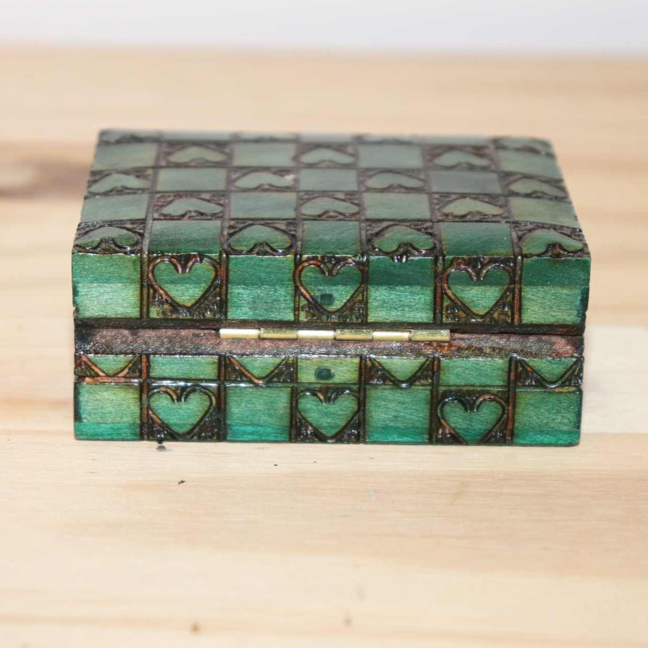 Wooden Chest Hearts Horse, natural wood, carved hearts, green color squares, detailed design and unique craftsmanship. Item measures approximately 3 x 2 inches
