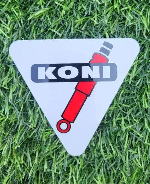 KONI SHOCKS PARTS DECAL MINT NOS Measuring 3 inches triangle, peel and stick adhesive decal, KONI shock parts and racing decal. PG Relics turning back time again