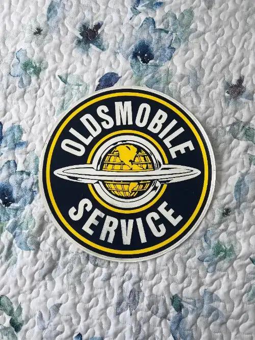Oldsmobile DECAL Global World SERVICE LARGE MINT NOS ITEM Classic LOOK. This is an approx 12 inch circle Oldsmobile SERVICE decal. Crest logo centered, great detail