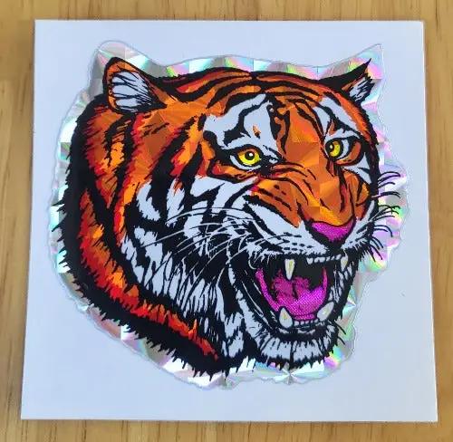 Tiger 1970s Iridescent DECAL ANIMALS BIG CATS DESIGN DECAL Measuring 2 1/2 x 2 1/2, iridescent design, really shines, big cat fangs and Panther/Cougar head. Decals PG Relics