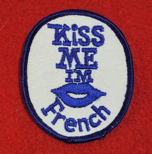 KISS ME IM French Patch, block lettering and great stitching. NOS Item, never sewn or displayed, stored away safely for decades and measures approx 4 x 3 inches