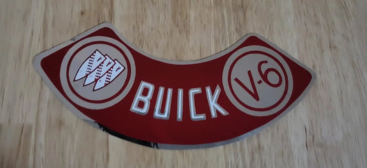 Buick 1977-79 V6 Air Cleaner Silver Decal New Old Stock Excellent Condition Relic has been safely stored away for decades and measures approximately 2 inches x 6.5 i