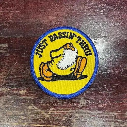 JUST PASSIN THRU PATCH ROBERT CRUMB VINTAGE MINT NOS RETRO ITEM UNIQUE measuring approximately 3 x 3 inches.  Robert Crumb design, Incredibly detailed stitching