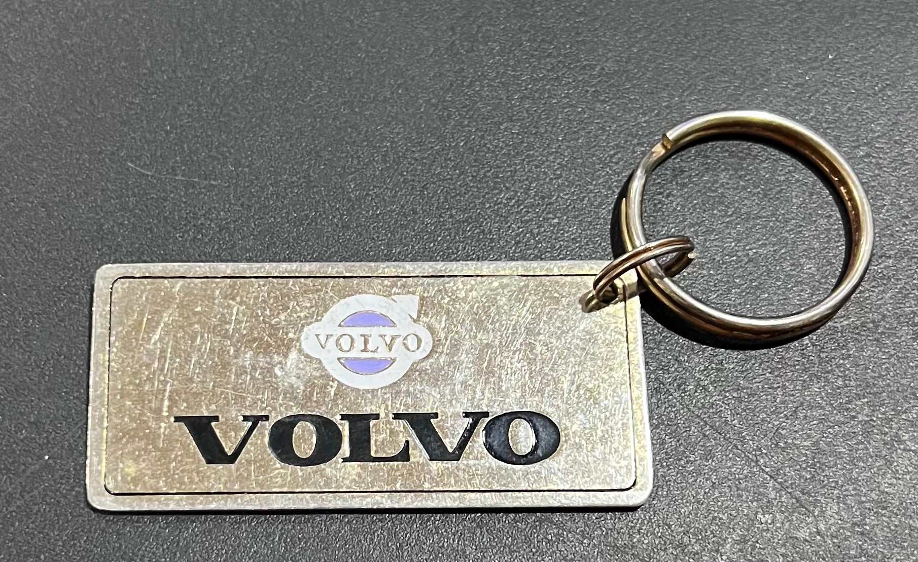 Volvo Logo Gold Plated Metal Keychain with Engravable Backside N.O.S. Relic has been store safely away for decades and shows some wear but vintage from the 1980s