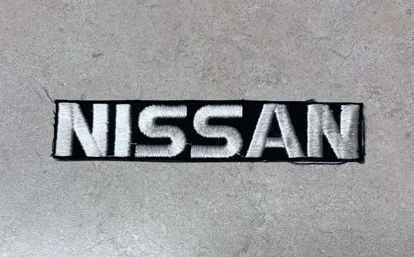Nissan Bold Lettering Serviceperson Patch Auto NOS Excellent Condition Relic has been safely stored away for decades and measures approximately 1 x 5.25 inches
