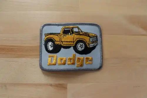 DODGE MONSTER TIRE TRUCKS PATCH AUTO NOS VINTAGE EXC GLITTER STITCHING VINTAGE NOS DODGE patch measuring 4 x 3 inches.  A great piece to add to your vintage pickup.