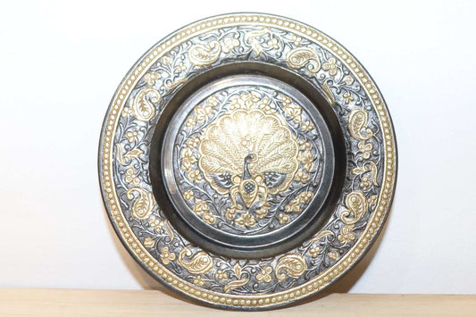 Vintage Brass Wall Plate of Indian origin  Peacock center design with wall hanging attachment.  Item measures 4 inches circle and is very detailed