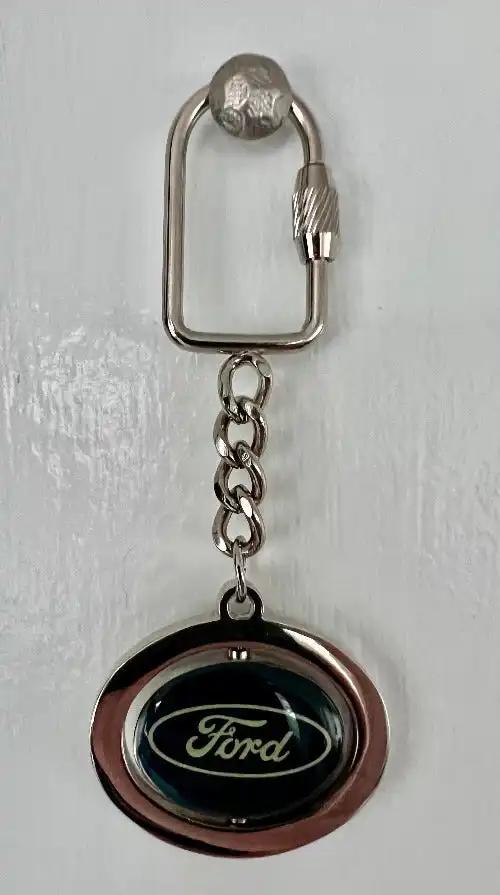 Ford Keychain Tradition Logo Spinning Center Accessories N.O.S. Item Ford logo spinning Center keychain with lock.  Mint, never used and stored away for decades.