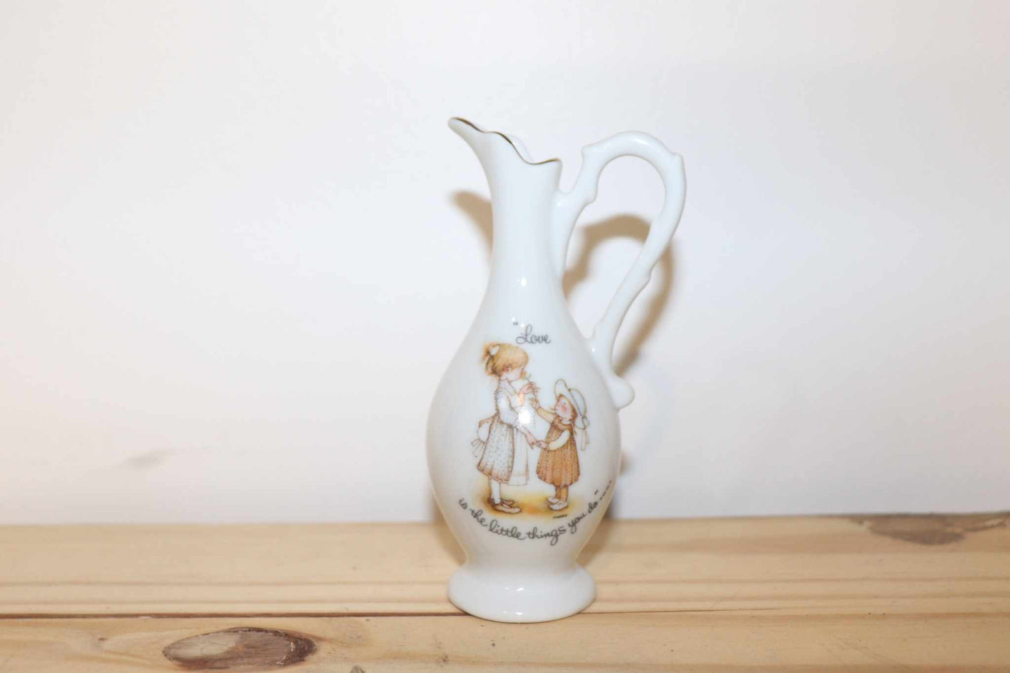 Porcelain Holly Hobbie Mini Pitcher Vintage Collectible Unique Made In Japan.  This measures 5 inches high by 2 1/2 inches wide, to the handle
