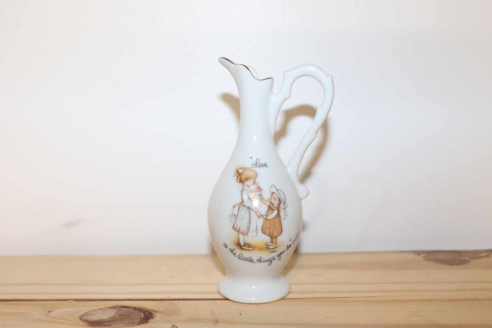 Porcelain Holly Hobbie Mini Pitcher Vintage Collectible Unique Made In Japan.  This measures 5 inches high by 2 1/2 inches wide, to the handle