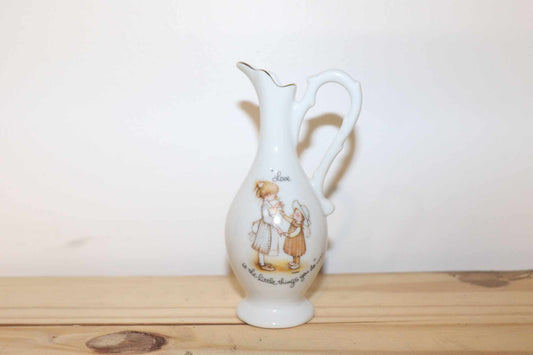 Porcelain Holly Hobbie Mini Pitcher Vintage Collectible Unique Made In Japan.  This measures 5 inches high by 2 1/2 inches wide, to the handle