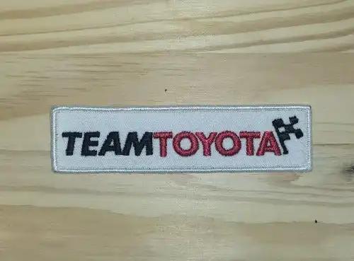 Team Toyota Patch Cross Flags Vintage Auto Racing NOS RARE Mint Item. This relic has been stored for decades and measures 1.25 inches wide and 4.75 inches in length